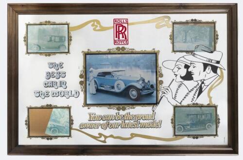 ROLLS-ROYCE: A Rolls-Royce decorative wall mirror in wooden frame 'The Best Car in the World -You can be&nbsp;the proud owner of our latest model' 62cm high, 94cm wide.