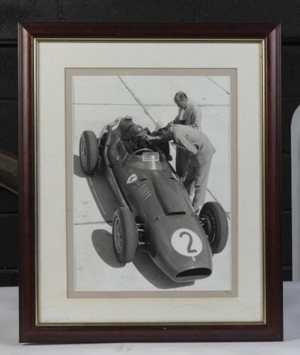 PETER COLLINS: A framed black and white photograph of Peter Collins Ferrari 246 F1&nbsp;Dino at the 1958 German Grand Prix, framed and glazed, numbered to lower margin '20/100',57cm high, 47cm wide