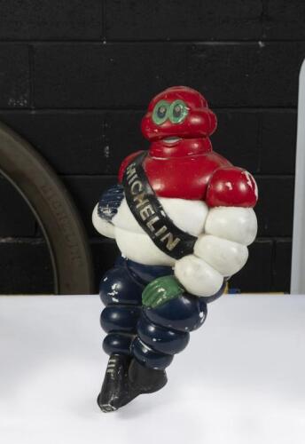 MICHELIN: A large plastic Michelin Bibendum figure later painted in red, white, & blue, approx 47cm tall
