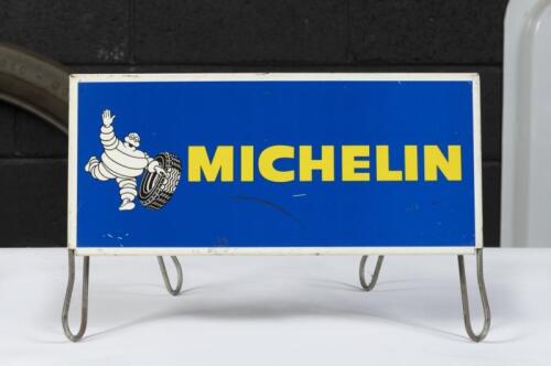 MICHELIN: A c1970s Michelin metal&nbsp;tyre rack with sign,&nbsp;15.5cm high, 35cm wide, stamped to reverse 'S-40- Made in France'