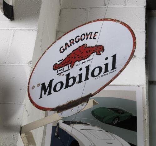 MOBILOIL: A double sided enamel 'Gargoyle Mobiloil' oval sign, believed to be English, 46cm high, 36cm wide.