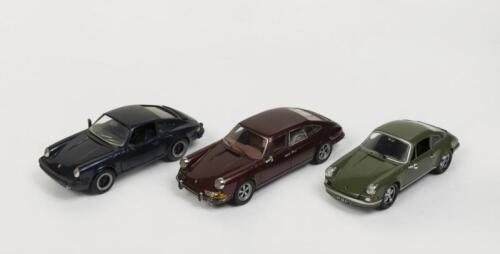 766 · PORSCHE: A group of three 1:43 scale Porsche models comprising an interesting Porsche 911 Troutman Barnes Sedan a Porsche 911S and a Porsche 911 Carrera