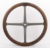 STEERING WHEEL: An early four spoke&nbsp;wooden rimmed steering wheel, 42.5cm in diameter