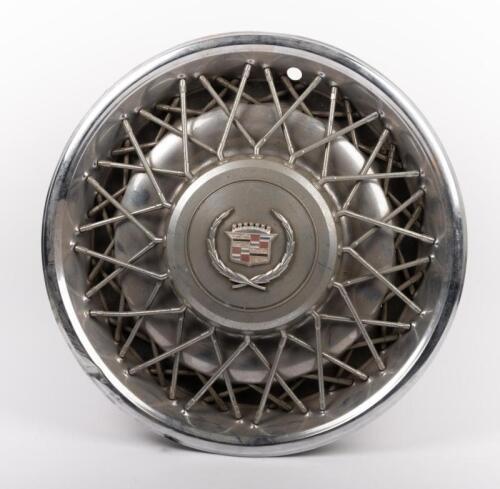 CADILLAC: A circa 1970s or 1980s Cadillac wire wheel steel hub cap, 42cm diameter overall