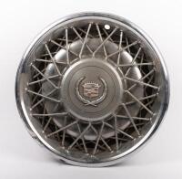 CADILLAC: A circa 1970s or 1980s Cadillac wire wheel steel hub cap, 42cm diameter overall