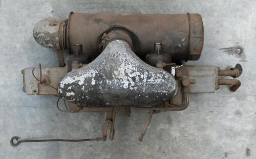 MANIFOLD: A circa 1950s/1960s manifold set-up with twin SU carburettors