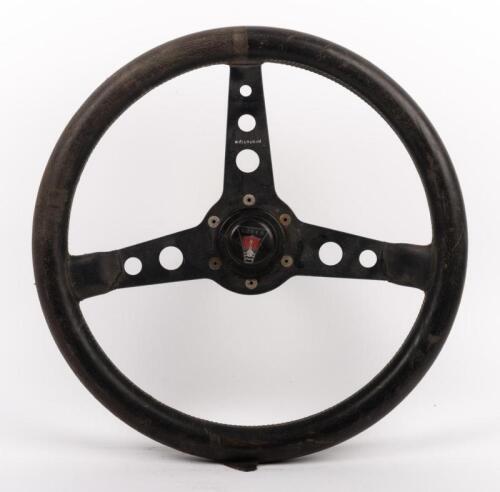 MOMO: A Momo Prototipo three spoke leather bound steering wheel with Rover horn pad