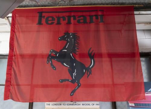 FERRARI: A large fabric Ferrari flag with prancing horse, approx 134cm high, 162cm wide