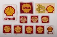 SHELL: An assortment ten of Shell cloth patches of varying sizes, also includes a 'Go Well - Go Shell' adhesive sticker