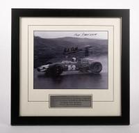 BRABHAM BT26: A signed, framed & glazed mounted portrait of Jack Brabham driving his Brabham&nbsp;BT26-Repco at the 1968 Dutch Grand Prix at Zandvoort, signed by both designer, Ron Tauranac and driver, Jack Brabham, 19.5cm high, 25cm wide (visible)
