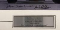 SIR JACK BRABHAM: A photo framed and glazed of Jack Brabham driving his BT26 in 1967, signed by both Brabham and team owner Ron Tauranac, 19.5cm high, 25cm wide - 2