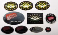 REPCO BRABHAM: A collection of nine miscellaneous stickers and cloth badges bearing the Repco Brabham name