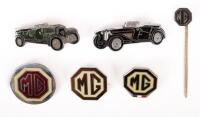 MG: A group of assorted MG related badges, includes two small octagon shaped lapel badges, one stick pin badge, one circular lapel badge and two classic car lapel badges