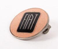 FIAT: A high quality Fiat lapel badge, possibly 1950s or 1960s, gold lettering on black emblem with peach coloured surround, 2cm in diameter