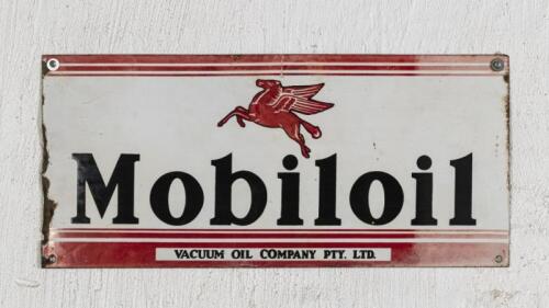 MOBIL: A original Australian Mobiloil ten bottle rack front enamelled sign, 27cm high, 58.5cm wide