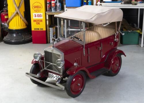 PEDAL CAR: A wonderful highly detailed Rolls-Royce Silver Ghost pedal car, with aluminium&nbsp;skinned timber frame tourer body, featuring collapsing canvas roof and opening doors, leather interior with embossed door cards, and Lucas front lights,&nbsp;approximatel