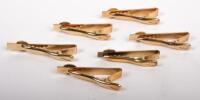 MOBIL: A collection of six Mobil tie pins featuring inset stones in the styles&nbsp;of white/colourless diamond, emerald, ruby, and sapphire, maker unknown however each stamped to rear '12012KGF' likely&nbsp;awarded to an employee for various levels of service - 2