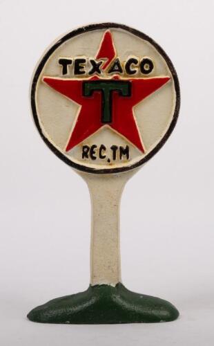 TEXACO/MOBIL: A reproduction painted cast iron 'Texaco' door stop, 23cm high, together with reproduction embossed tin 'Mobilgas' sign 66cm high, 25cm wide