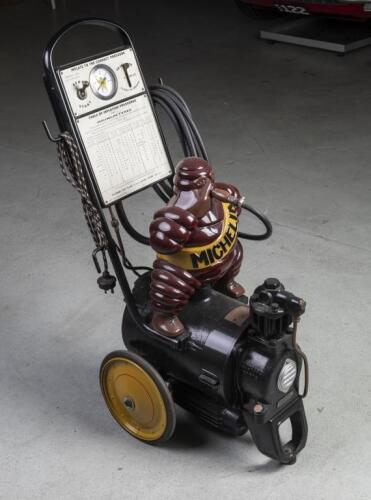 MICHELIN: A circa 1930s Michelin Tyres portable trolley compressor with seated Bibendum figure, restored for David by Peter Vandersluys