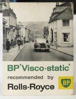 BP: An impressive poster produced by BP, dated 1959, 'BP 'Visco-static' Recommended by Rolls-Royce' with a&nbsp;Rolls-Royce pictured driving down a town&nbsp;street, laminated over a small block, 64cm high, 48cm wide