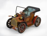 TIN TOY: A small Japanese 'Modern Toys' tin toy in the style of a Veteran car,&nbsp;14cm long