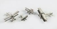 BIPLANES: A group of four small scale chrome biplane models