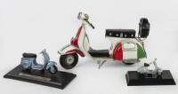 VESPA: A group of three Vespa models comprising a large&nbsp;tin model and two smaller scale&nbsp;diecast models a&nbsp;Maisto 1966 Vespa 50L and a&nbsp;Newray&nbsp;1946 Vespa 98
