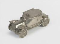 INKWELL: An early automobile Inkwell model in silver finish with opening lid and ceramic thimble inside, approx 13cm long