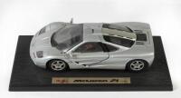 McLAREN: A 1:18 scale Special Edition Maisto 1993 McLaren F1, silver, grey interior, opening features, engine detail, steerable wheels; presented fixed on display base with nameplate