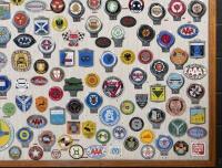 CAR CLUB BADGES: A large collection of approximately 100 car club badges from both Britain, Australia and the USA presented fixed to framed wooden board - 3