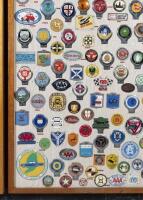CAR CLUB BADGES: A large collection of approximately 100 car club badges from both Britain, Australia and the USA presented fixed to framed wooden board - 4
