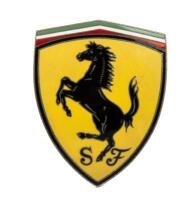 FERRARI: A fine enamel 'Scuderia Ferrari' prancing horse three pin curved badge, 10cm high
