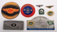 BENTLEY: A group of Bentley related items comprising a&nbsp;Bentley Belt buckle, two small winged Bentley logo pins, National Bentley Rally 2008 plaque, a Bentley coaster, a RREC Flemish Section badge and two others