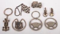 KEY CHAINS: A mixed group&nbsp;of items including keychains, a Tattersals Clash of the Titans 1997, a 1999 AGP, a pair of miniature Jaguar E-Types, Steering wheels and others