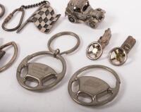 KEY CHAINS: A mixed group&nbsp;of items including keychains, a Tattersals Clash of the Titans 1997, a 1999 AGP, a pair of miniature Jaguar E-Types, Steering wheels and others - 2
