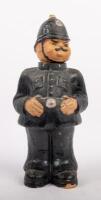 BRITISH POLICEMAN: A paper mache British Policeman figurine with removable head for storage, 33cm high