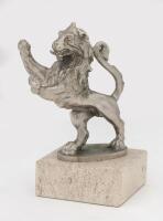 RAMPART LION: A 'Rampart Lion' hood ornament mascot mounted on marble base