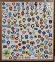 CAR CLUB BADGES: A large collection of approximately 100 car club badges from both Britain, Australia and the USA presented fixed to framed wooden board