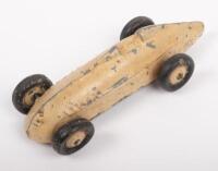 TIMPO TOYS RACE CAR BEIGE: A Timpo Toys model race car, based on a land speed race car, beige, made in England