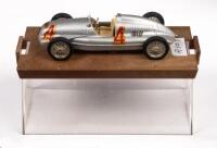 AUTO UNION TYPE D #4 NUVOLARI&nbsp;1938 GP: An Auto Union model car, the number #4 race car as driven by Tazio&nbsp;Nuvolari, in the 1938 GP at Donington Park, manufactured by Brumm models, product number R109