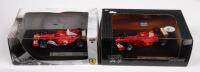 FERRARI MICHAEL SCHUMACHER: Two&nbsp;1:43 scale Hot Wheels Racing models including a Ferrari F1 2001 and a Ferrari F2004 both driven by Michael Schumacher