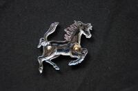 FERRARI: A Ferrari 'Prancing Horse' chromed pressed metal badge, 7.5cm high - 2