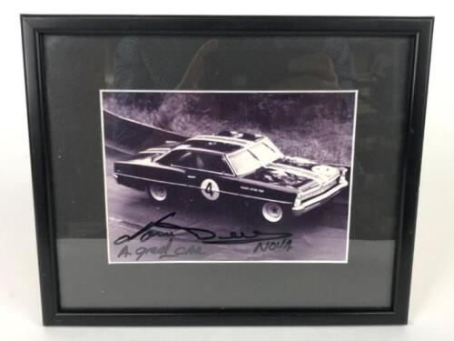NORM BEECHEY: A small photograph&nbsp;of Norm Beechey in his Chevy Nova signed and inscribed "A Great Car, Nova, Norm Beechey" framed and glazed (12cm high x 17cm wide)