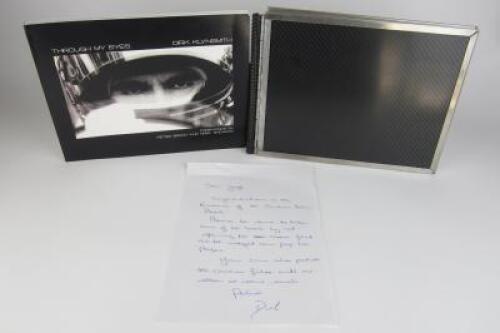 PHOTOGRAPHY: A carbon fibre bound book titled &lsquo;Through My Eyes&rsquo; by photographer Dirk Klynsmith&nbsp;(signed by Skaife and Ambrose)