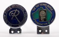 HENRY ROYCE: A pair of Sir Henry Royce foundation grille badges, first badge epoxy coated, with the number #24 stamped on the rear, 7.5cm diameter, second badge epoxy coated, 7.5cm diameter