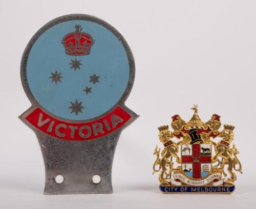MELBOURNE VICTORIA: A pair of badges, a Victoria car grille badge, c1970's, 7cm x 10.5cm, also a city of Melbourne enamel cap/hat badge, has 2 lugs and split pins on rear, 5cm x 5cm
