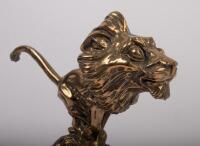 PEUGEOT: A circa 1920s bronze Peugeot lion mascot, engraved 'Baudichon' to lower front, affixed to bakelite base, 12cm high - 2