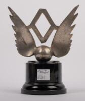 MASCOT: An early nickel plated brass winged mascot with inset central diamond affixed to bakelite&nbsp;base, 9cm high - 2