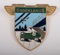 BROOKLANDS: An enamel 'Brooklands' winged badge, stamped 'TM' to rear
