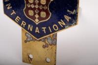 PACKARDS: A brass Packards International grille badge - 2